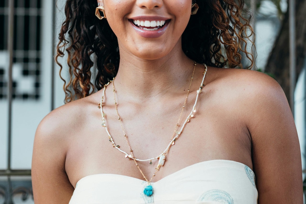 A pearl necklace on a woman's neck. A pearl necklace on a woman's neck.